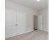 Bedroom featuring double doors to closet space; neutral walls and carpet create a soothing space at 625 Woodside Dr., Conway, SC 29526