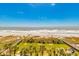 Expansive view of ocean and sandy beach with palm trees at 6804 N Ocean Blvd. # 523, Myrtle Beach, SC 29572