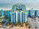 Brightly colored exterior of beachfront condo with pool, parking, and ocean views at 6804 N Ocean Blvd. # 523, Myrtle Beach, SC 29572
