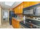 Functional kitchen featuring a range, microwave, refrigerator, and ample cabinet space at 6804 N Ocean Blvd. # 523, Myrtle Beach, SC 29572
