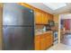 Compact kitchen includes stainless steel appliances and dark cabinetry for a clean, modern look at 6804 N Ocean Blvd. # 523, Myrtle Beach, SC 29572