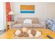 Neutral colored living room with comfortable couch and decorative accents on coffee table at 6804 N Ocean Blvd. # 523, Myrtle Beach, SC 29572
