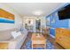 Comfortable condo living room with coastal decor, sofa, and dining area at 6804 N Ocean Blvd. # 523, Myrtle Beach, SC 29572