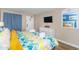 Stylish main bedroom with a large bed, side tables, a dresser and television at 6804 N Ocean Blvd. # 523, Myrtle Beach, SC 29572