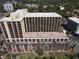 Stunning aerial view of large building with private balconies and rooftop pool at 6900 N Ocean Blvd. # 1034, Myrtle Beach, SC 29579