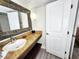 Well-appointed bathroom with granite countertop, mirror and ample lighting at 6900 N Ocean Blvd. # 1034, Myrtle Beach, SC 29579