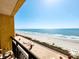 Breathtaking ocean view from the balcony overlooking a pristine beach with clear blue waters at 6900 N Ocean Blvd. # 1034, Myrtle Beach, SC 29579