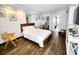 Cozy bedroom with a queen bed, wood floors, and modern decor at 6900 N Ocean Blvd. # 1034, Myrtle Beach, SC 29579