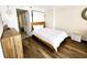The well-lit bedroom is furnished with a comfortable bed, dresser, and modern decor at 6900 N Ocean Blvd. # 1034, Myrtle Beach, SC 29579