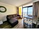 Inviting living room with comfortable seating, a dining table, and stunning ocean views through large windows at 6900 N Ocean Blvd. # 1034, Myrtle Beach, SC 29579