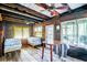 Bedroom with two beds, ceiling fans, wood walls and ceilings, and natural light from large windows at 70 Izard Pl., Georgetown, SC 29440