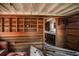 Dilapidated cabin interior featuring damaged wood walls, exposed beams, and general disrepair throughout at 70 Izard Pl., Georgetown, SC 29440