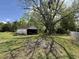 Backyard with detached garage covered by shade tree at 701 Martin Luther King Dr., Andrews, SC 29510