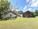 Wide open backyard featuring a detached garage and shade trees at 701 Martin Luther King Dr., Andrews, SC 29510