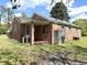 A quaint brick home with a small porch and green yard at 701 Martin Luther King Dr., Andrews, SC 29510