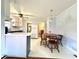 Spacious kitchen with white cabinets, a dining area, and plenty of natural light at 701 Martin Luther King Dr., Andrews, SC 29510