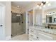 A bathroom with a glass enclosed shower, and granite countertops at 7041 Turtle Cove Dr., Myrtle Beach, SC 29579
