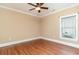 Bedroom featuring hardwood floors, a ceiling fan, and a window at 7041 Turtle Cove Dr., Myrtle Beach, SC 29579