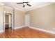 Spacious bedroom featuring hardwood floors, crown molding, and a ceiling fan at 7041 Turtle Cove Dr., Myrtle Beach, SC 29579