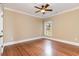 Bedroom with hardwood floors, a ceiling fan, a window, and neutral walls at 7041 Turtle Cove Dr., Myrtle Beach, SC 29579