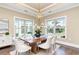Elegant dining room with modern chandelier, large windows, and stylish decor at 7041 Turtle Cove Dr., Myrtle Beach, SC 29579