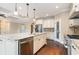 Kitchen showcasing granite countertops, stainless steel appliances, and an island with a sink and dishwasher at 7041 Turtle Cove Dr., Myrtle Beach, SC 29579
