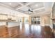 An open living space featuring an island kitchen, living room with fireplace, and sliding glass doors at 7041 Turtle Cove Dr., Myrtle Beach, SC 29579