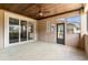 Covered outdoor patio with multiple windows and an exterior door at 7041 Turtle Cove Dr., Myrtle Beach, SC 29579