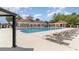 Enjoy a refreshing swimming pool with deck chairs and shade areas, perfect for relaxation and recreation at 7041 Turtle Cove Dr., Myrtle Beach, SC 29579