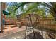 Relaxing backyard with patio swing set, outdoor seating, and a wooden fence at 707 S 26Th Ave. S # L, North Myrtle Beach, SC 29582