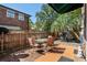 Spacious backyard with a patio, seating, and mature trees at 707 S 26Th Ave. S # L, North Myrtle Beach, SC 29582
