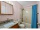 Bathroom with granite countertop, tile floors, and a shower with a blue curtain at 707 S 26Th Ave. S # L, North Myrtle Beach, SC 29582