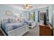 Bedroom with two beds, blue bedding, two windows, and a ceiling fan at 707 S 26Th Ave. S # L, North Myrtle Beach, SC 29582