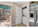 A tidy laundry area is conveniently located near an outside patio and modern stainless steel refrigerator at 707 S 26Th Ave. S # L, North Myrtle Beach, SC 29582