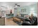 Open-concept living area with bar seating, ceiling fan, and stylish decor at 707 S 26Th Ave. S # L, North Myrtle Beach, SC 29582
