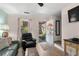 Cozy living room with comfortable seating, hardwood floors, and a decorated front door at 707 S 26Th Ave. S # L, North Myrtle Beach, SC 29582