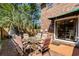 Brick patio with an outdoor dining set and lush landscaping at 707 S 26Th Ave. S # L, North Myrtle Beach, SC 29582