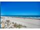 Expansive beach view showcasing the sandy shoreline and ocean waves, perfect for a serene getaway at 720 N Waccamaw Dr. # 207, Garden City Beach, SC 29576