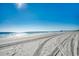 Bright, sunny day on a beautiful, sandy beach with clear ocean water at 720 N Waccamaw Dr. # 207, Garden City Beach, SC 29576