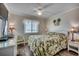 Serene bedroom with a palm tree theme, adorned with tropical bedding and ocean views at 720 N Waccamaw Dr. # 207, Garden City Beach, SC 29576