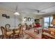 Inviting living room with wicker furniture, ocean view, wood floors, and coastal-themed decor at 720 N Waccamaw Dr. # 207, Garden City Beach, SC 29576