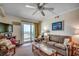 Cozy living room featuring a sliding glass door leading to a balcony with ocean views at 720 N Waccamaw Dr. # 207, Garden City Beach, SC 29576