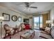 Comfortable living room with ocean view, wicker furniture, wood floors, and coastal-themed decor at 720 N Waccamaw Dr. # 207, Garden City Beach, SC 29576
