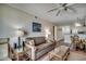 Inviting living room featuring a comfortable sofa and views into the dining and kitchen area at 720 N Waccamaw Dr. # 207, Garden City Beach, SC 29576