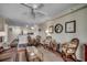 Comfortable living room with seating area and adjacent dining space, stylish decor at 720 N Waccamaw Dr. # 207, Garden City Beach, SC 29576