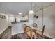 Living space featuring a dining table and access to kitchen, designed with stylish wood flooring and coastal decor at 720 N Waccamaw Dr. # 207, Garden City Beach, SC 29576