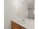 Bathroom vanity with white countertop, mirror, and wood cabinets at 775 Plantation Dr. # 87, Little River, SC 29566