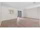 Light bedroom featuring wood-look flooring and a sliding glass door at 775 Plantation Dr. # 87, Little River, SC 29566