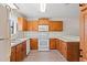 Functional kitchen features white appliances, wood cabinets, and white countertops at 775 Plantation Dr. # 87, Little River, SC 29566