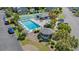 Aerial view of the community pool, tennis courts, gazebo, and seating areas for residents at 775 Plantation Dr. # 87, Little River, SC 29566